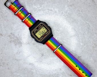 Casio F-91 Watch with Pride Rainbow Nylon Strap (Gold detail dial). Option to add a Screen Colour mod, 8 colours to choose from