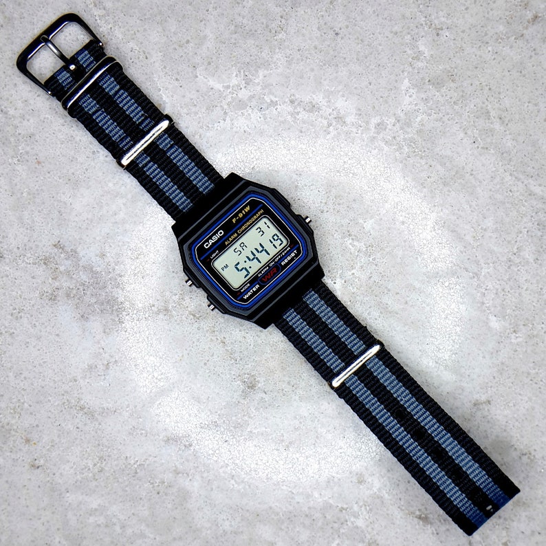 Casio F-91 Watch: Black Resin With James Bond Nylon Strap, F-91W-1YEF ...