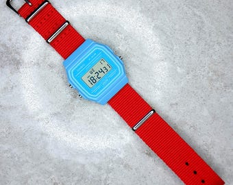 Casio F-91 Watch (Light Blue) on a Red nylon Strap, F-91WC-2AEF