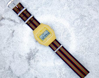 Casio Digital Watch, Yellow Edition on a Bond 007 Nylon strap, F91WC-4A2EF