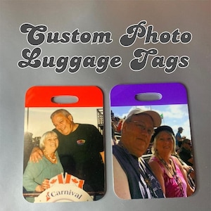 May include: Two custom photo luggage tags with a red and purple background. The tags feature photos of a couple, one in front of a carnival ride and the other at a sporting event. The text "Carnival" is visible on the red tag.