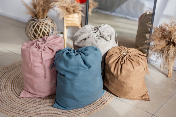 Drawstring Laundry or Storage Bag in White Color. Linen and Washable Paper Material