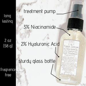 May include: A clear glass bottle of 2-in-1 Toner Serum containing 3% Niacinamide and 2% Hyaluronic Acid. The bottle features a black treatment pump, a white label with text, and a net weight of 2 oz (58 g). The product is fragrance free and long lasting.