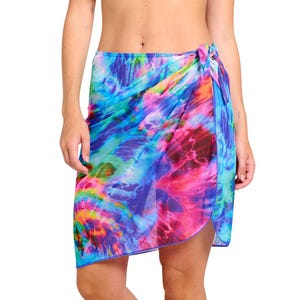 May include: A colourful tie-dye sarong with a blue, pink and purple swirl pattern. The sarong is made of a sheer fabric and has a fringed edge.