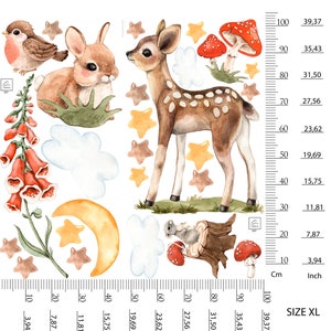 May include: A watercolor illustration featuring a fawn, a rabbit, a bird, mushrooms, and stars. The illustration is on a white background with a ruler in the bottom right corner. The ruler is marked in centimeters and inches.
