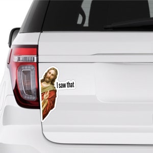 May include: A white car with a sticker of Jesus saying "I saw that".