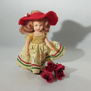 Vintage Nancy Ann storybook doll, 1950&#39;s series collectible, dressed in an alphabet dress with silk flowered pants