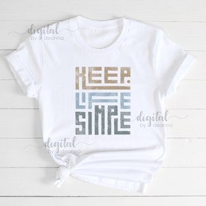 May include: White t-shirt with the text "KEEP LIFE SIMPLE" in a distressed, layered font with blue and brown colors.