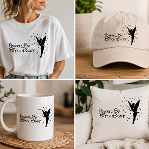 May include: A white t-shirt, a beige baseball cap, a white ceramic mug, and a white square throw pillow. Each item features a black graphic of a fairy silhouette with the text Powered By Bitch Dust and small star accents printed on the front.