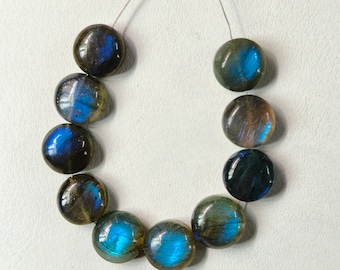 May include: A strand of round, iridescent labradorite beads in shades of blue and grey. The beads are strung on a thin cord and are ready to be used for jewelry making.