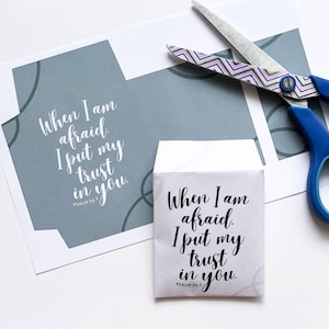 May include: A printable envelope with a gray background and white text. The text reads "When I am afraid, I put my trust in you. Psalm 56:3".