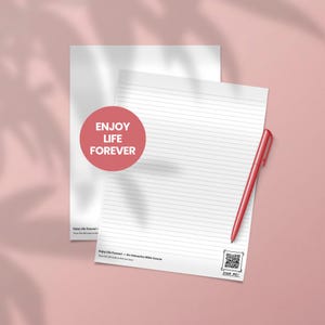 May include: Two white lined paper sheets with a red pen on a pink background. One sheet has a red circle with the words "ENJOY LIFE FOREVER". The other sheet has a QR code and the words "SCAN ME!"