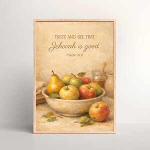 May include: A framed print featuring a still life of apples and pears in a bowl, with a jar of honey. The text "TASTE AND SEE THAT Jehovah is good" is displayed above the fruit, with "PSALM 34:8" below.