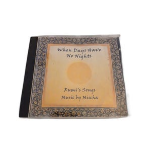 May include: A CD case with the title "When Days Have No Nights" and "Rumi's Songs" printed on the cover. The cover has a yellow background with a sun graphic and decorative floral border. The artist's name, Mischa, is also printed on the cover.