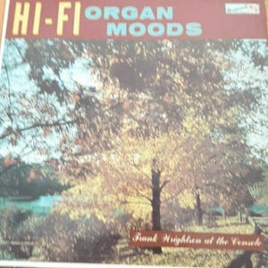May include: Vintage vinyl record album cover with the text "HI-FI ORGAN MOODS" in yellow and blue. The album art features a tree with yellow and brown leaves, with the text "Frank Wrightson at the Console" at the bottom.