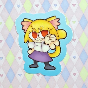 Può includere: Un adesivo con un personaggio dei cartoni animati con capelli gialli, occhi rossi e una gonna viola. Il personaggio indossa una camicia bianca e ha orecchie da gatto. L'adesivo è su uno sfondo blu.