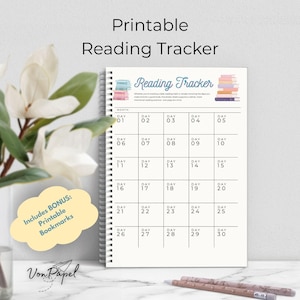 May include: A spiral-bound reading tracker with the text "Printable Reading Tracker." The calendar-style pages are designed to track daily reading habits. Includes bonus printable bookmarks. Pens and a flower arrangement are in the background.