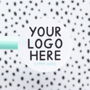 May include: White round sticker with black text that says "YOUR LOGO HERE" and "37MM WIDE".