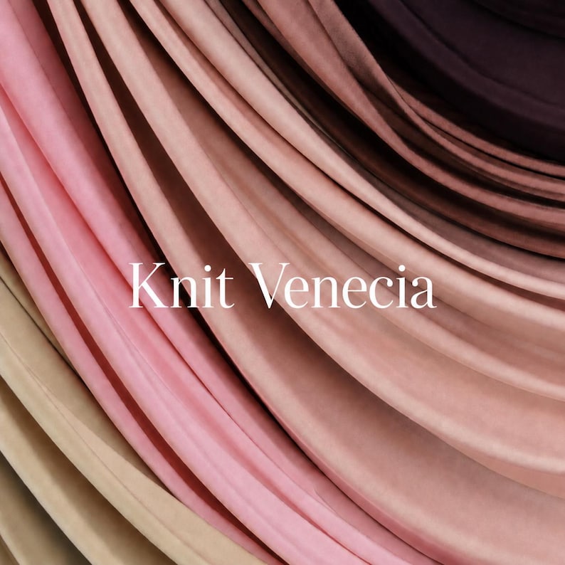 May include: A collection of layered fabric in a gradient of colours ranging from beige and light pink to dusty rose, mauve, and deep dark brown. The fabric features a smooth, matte texture with soft folds and the white text Knit Venecia centred.