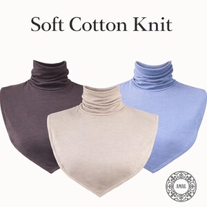 May include: Three soft cotton knit turtleneck collars in brown, beige, and light blue. The collars are displayed on a white background. The text "Soft Cotton Knit" is at the top of the image.