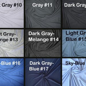 May include: A selection of fabric swatches in various shades of grey and blue. The swatches are labelled with color names and numbers, including light grey, grey, dark grey, and various melange and blue-toned options. The fabric is draped.