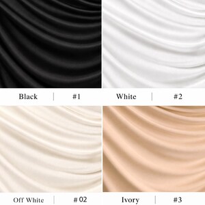 May include: A grid of four fabric swatches featuring draped, smooth material. The top left is black labelled Black #1, top right is white labelled White #2, bottom left is off-white labelled Off White #02, and bottom right is ivory labelled Ivory #3.