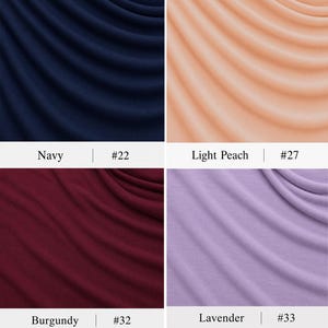 May include: A grid of four fabric swatches featuring draped folds. The top left is navy blue labelled #22, the top right is light peach labelled #27, the bottom left is burgundy labelled #32, and the bottom right is lavender labelled #33.