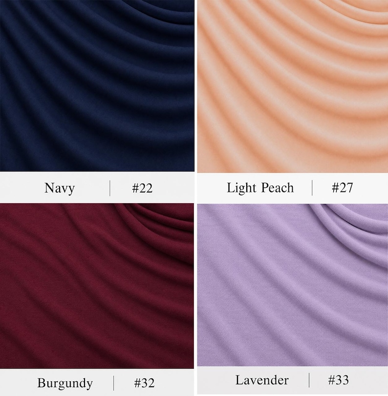 May include: A grid of four fabric swatches featuring draped folds. The top left is navy blue labelled #22, the top right is light peach labelled #27, the bottom left is burgundy labelled #32, and the bottom right is lavender labelled #33.