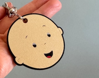 Caillou “Professional Headache” Keychain – Tiny Bald Menace Energy