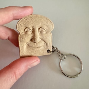 Surreal Toast Face Sculpture Keychain | Quirky Bread Art Charm, Oddity Accent Keychain