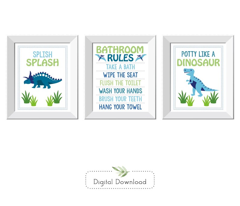May include: Three framed bathroom art prints with dinosaur themes. One says "Splish Splash" with a blue dinosaur. Another lists "Bathroom Rules." The third says "Potty Like a Dinosaur" with a blue dinosaur.