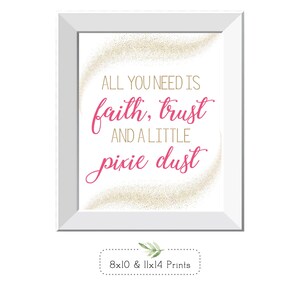 May include: A framed print with the words "ALL YOU NEED IS faith, trust AND A LITTLE pixie dust" in gold and pink script. The print is in a white frame with a white background and gold glitter accents. The print is available in 8x10 and 11x14 sizes.
