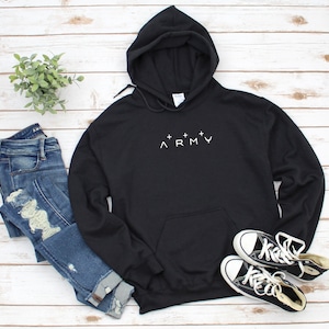 May include: Black hooded sweatshirt with a white embroidered design that says "^+^+^ ARMY".