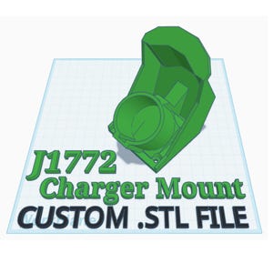 Puede incluir: Un soporte de cargador impreso en 3D de color verde con el texto "J1772 Charger Mount CUSTOM .STL FILE".