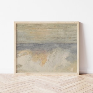 May include: A framed watercolor painting of a seascape with a light blue sky and a yellow and white foreground. The painting is in a light wood frame.