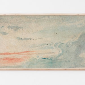 Könnte beinhalten: Ein gerahmtes Aquarellbild, das einen bewölkten Himmel mit einem Hauch von Orange am Horizont darstellt. Das Bild ist in einem hellen Holzrahmen.