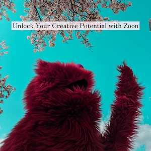 May include: A red furry puppet with its arm raised, standing in front of a blue sky with white cherry blossoms in the background. The text "Unlock Your Creative Potential with Zoon" is displayed at the top of the image.