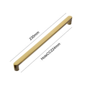 May include: A gold-toned cabinet pull with a 230mm length and a 224mm center-to-center hole spacing.  HoleCC224mm.
