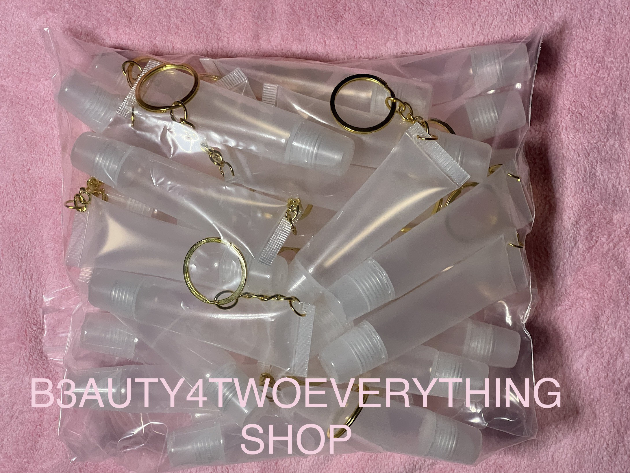 Custom round Empty lipgloss tube keychain 1.5 ml Mini lip gloss bottles  with key chain for cosmetic packaging-ITOE