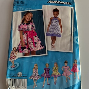 Toddlers Childs Dresses size 1/2 to 3 sewing pattern 2989 S See Full Listing. Condition is “New”.