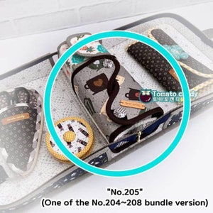 May include: A close-up of a gray and white fabric pouch with a zipper closure. The pouch is decorated with a pattern of teacups and hearts. The pouch is labeled "No. 205" and is part of a bundle of similar pouches.
