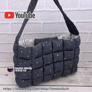 May include: A navy blue quilted tote bag with a repeating star pattern and a matching strap. The bag has a padded, textured appearance and a contrasting patterned interior. The Etsy shop URL is visible at the bottom of the image.