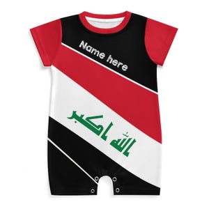 May include: A baby romper featuring the Iraqi flag design. The romper has red sleeves and a black and white body with a diagonal red stripe. The text "Name here" is printed on the top.