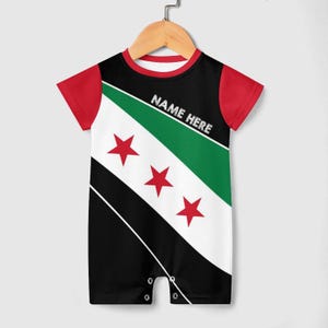 May include: A baby romper with a design featuring red stars, green and white stripes, and black sections. The romper has red sleeves and a white collar. The text "NAME HERE" is printed on the front.