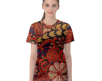 May include: A short-sleeved t-shirt with a vibrant floral pattern. The design features red, gold, and blue flowers and swirling shapes on a black background. The shirt is a crew neck style.