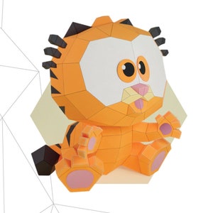 May include: A 3D paper model of a cartoon orange and black cat with a pink nose and tongue. The model is assembled and sitting on a white background. The model is 77 pieces and measures 10 inches by 9 inches by 8 inches.