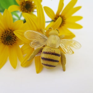 insect brooches, upcycled toys