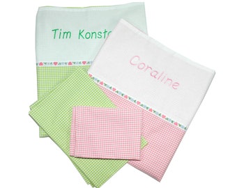 Checked children's bed linen embroidered with names