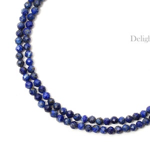 May include: A double strand necklace made of dark blue faceted lapis lazuli beads.