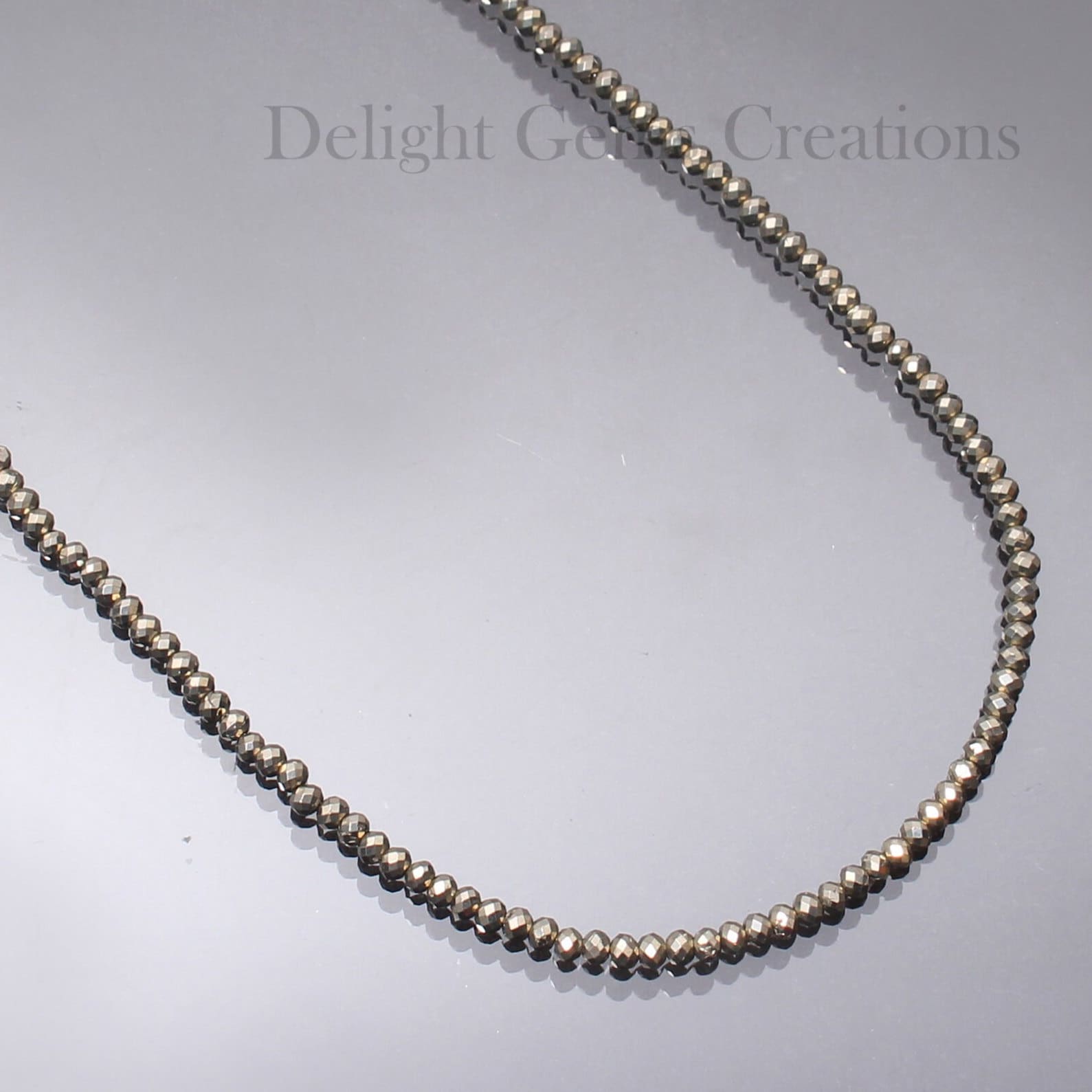 Rangs de perles Pyrite naturelles pour créations bijoux